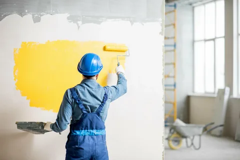 Painter using high-quality equipment for commercial painting services