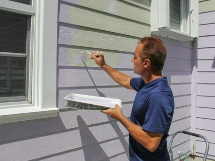 Damaged vinyl siding needing surface repair before painting — professional preparation by ProCut Paint for paint vinyl siding projects